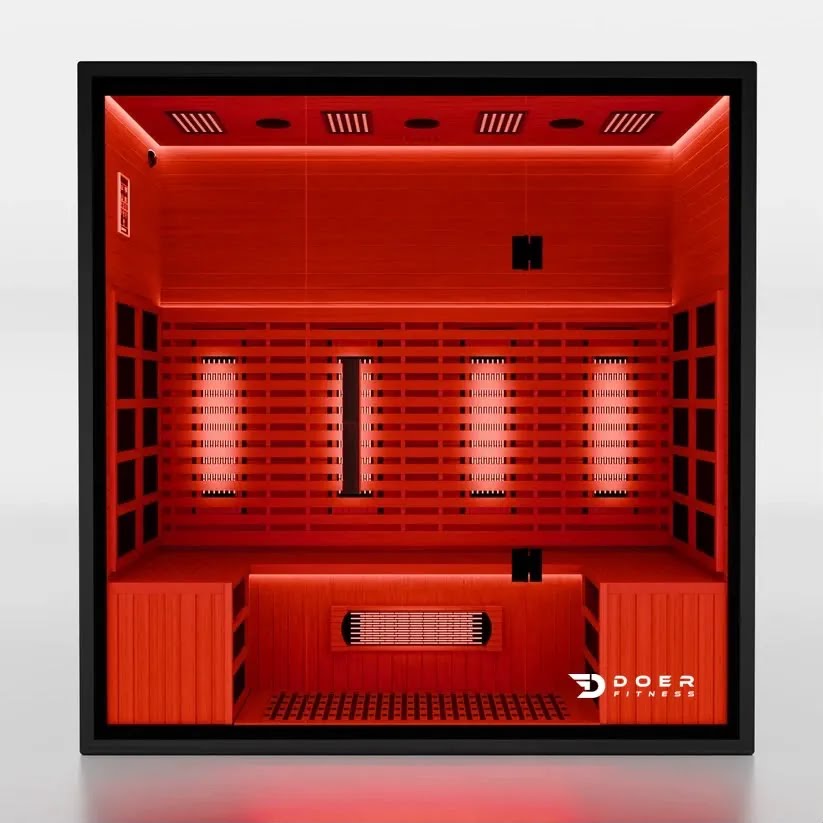 Sauna infrarroja ITERA Ember 100 Indoor 4 personas con luz roja encendida y bancas laterales